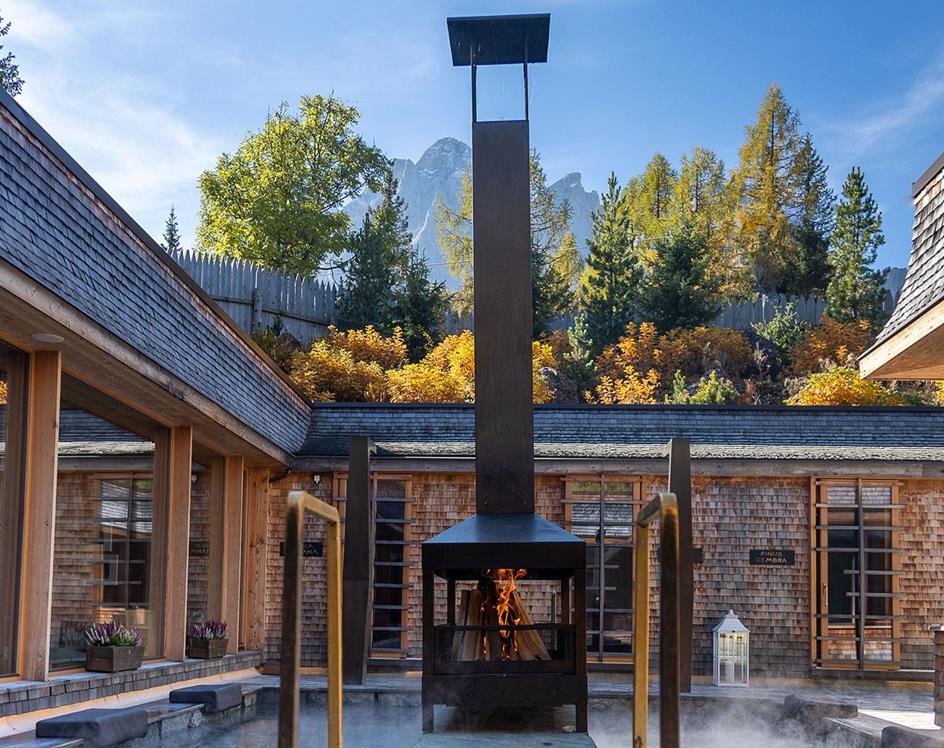 Piscina con stufa a legna
